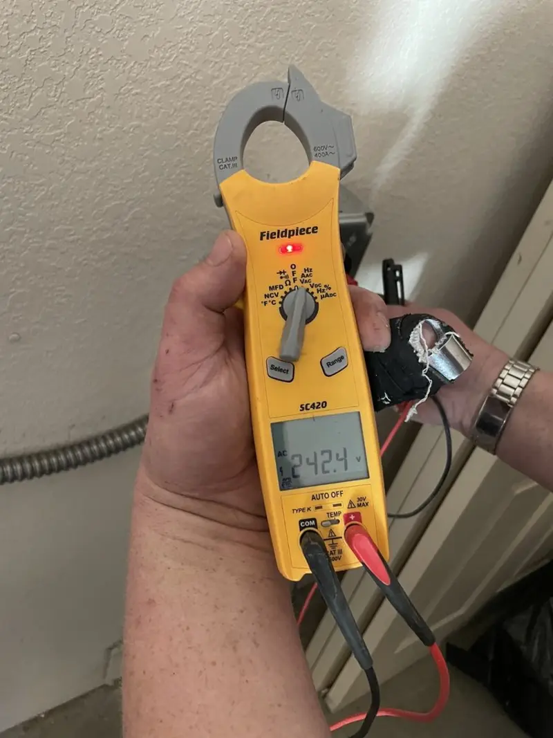 Voltage testing with clamp meter during Recessed Lighting Installation in Cranberry